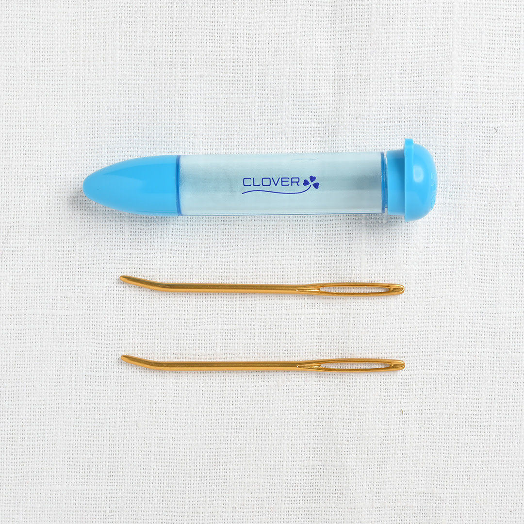 Two jumbo darning needles in tube